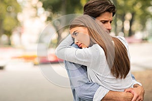 Sad Guy And Girl Hugging Feeling Unloved Standing Outdoors