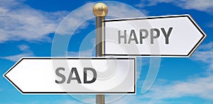 Sad and happy as different choices in life - pictured as words Sad, happy on road signs pointing at opposite ways to show that