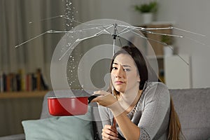 Sad homeowner with a bad insurance concept photo