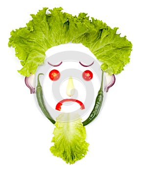 Sad human head made of vegetables