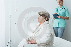 Sad ill woman at hospital