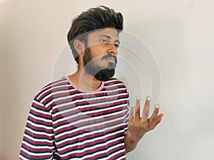 Sad Indian beard man, showing helpless gesture with arm
