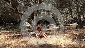 Sad Kid Playing in Olive Orchard, Meditative Kid, Bored Child Relaxing by Tree in Park, Unhappy Teenager Farmer Girl on Meadow in