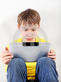 Sad Kid with Tablet Computer