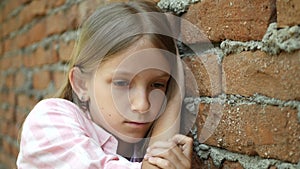 Sad Kid, Unhappy Child, Thoughtful Bullied Girl in Park, Depression of Adolescents, Children Expression in Coronavirus Pandemic