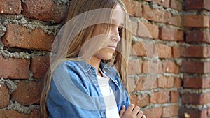 Sad kid, unhappy child, thoughtful bullied teenager girl outdoor in park, children sadness, depression portrait of adolescents