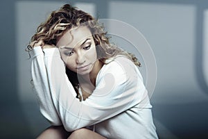 Sad Latin lady before shadows