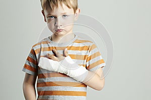 Sad little boy.child with a broken arm