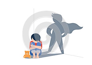 Sad little boy with teddy bear sitting on floor, superhero shadow on the wall. Child abuse, violence against children