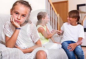 Sad little girl is jealous sister of stepbrother