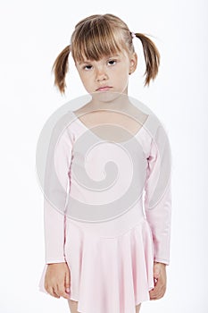 Sad little girl with pigtails