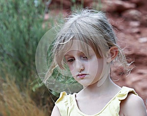 A Sad Little Girl with Wispy Hair