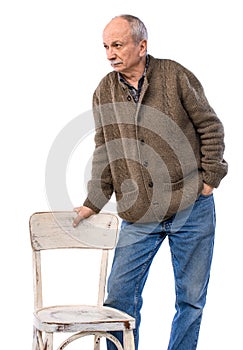 Sad lonely elderly man posing in studio on a white background