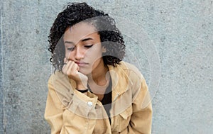 Sad and lonely latin american woman