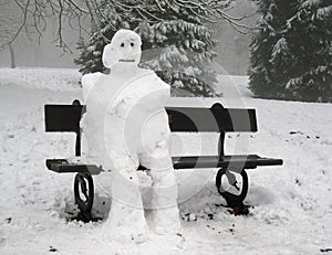 Sad Lonely Snowman seated alone