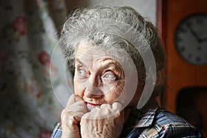 Sad and looking grandmother face