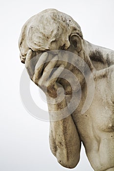 sad male statue