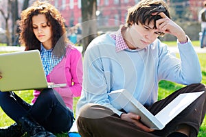 Sad male student at the park