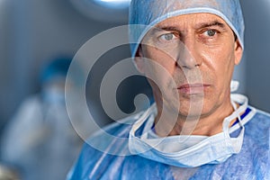 Sad male surgeon glancing despondently photo