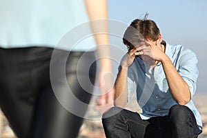 Sad man complaining outdoors after break up photo