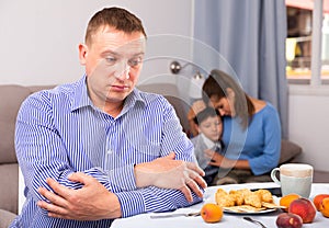 Sad man after disagreements with wife and son