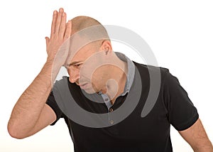 Sad man with hand on head