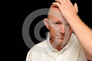 Sad man holding head