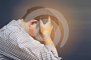 Sad man holding head