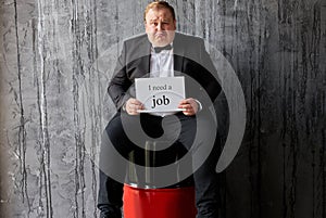 Sad man looking for new job due to drop in oil prices