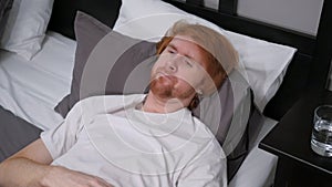 Sad Man Lying in Bed Feeling Uncomfortable, Unrest photo