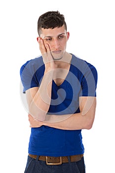 Sad man is thinking with hand against his head