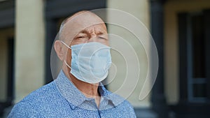 Sad man wrinkles mask look camera. Pandemic person. Coronavirus. People portrait