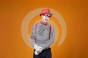 Sad mime man in vest and red hat Isolated