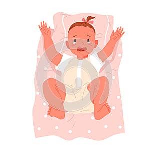 Sad newborn baby crying, babysitting, toddler lying on pink polka dot blanket and pillow photo