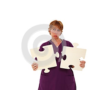 Sad Nurse Holding Puzzle Pieces