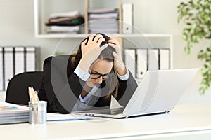 Sad office worker complaining after bankruptcy photo