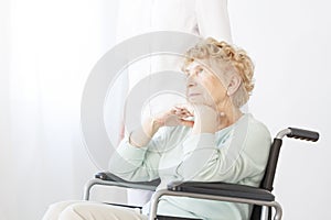 Sad pensioner in wheelchair