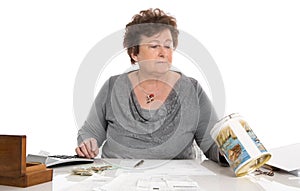 Sad pensioner woman have money problems - poverty in the age.