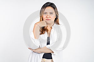 sad portrait of young asian woman over isolated background