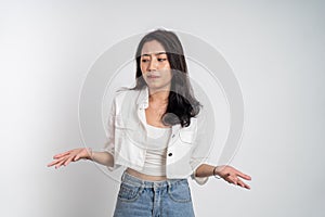 sad portrait of young asian woman over isolated background