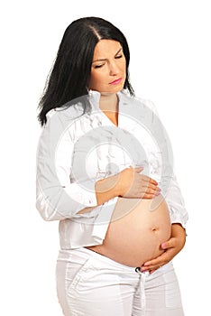 Sad pregnant woman with stomach ache