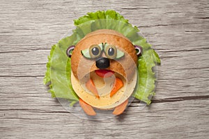 Sad sandwich hamster made on wooden background