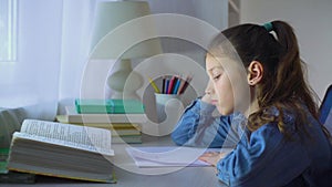 Sad school girl chewing pen while doing complicated homework