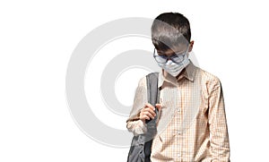 Sad schoolboy in protective mask on white isolated background