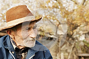 Sad senior man in hat