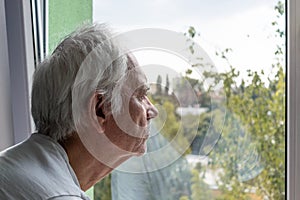 Sad senior man male alone home closeup depressed coronavirus isolation widower unhappy abandoned