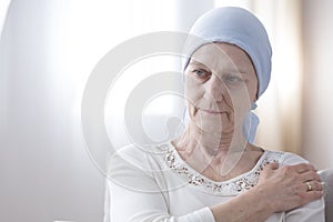 Sad senior woman with cancer