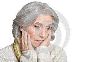 Sad senior woman isolated on white background