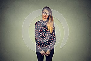 Sad shy insecure woman in glasses looking down avoiding eye contact