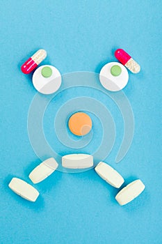Sad smileyface made of pills